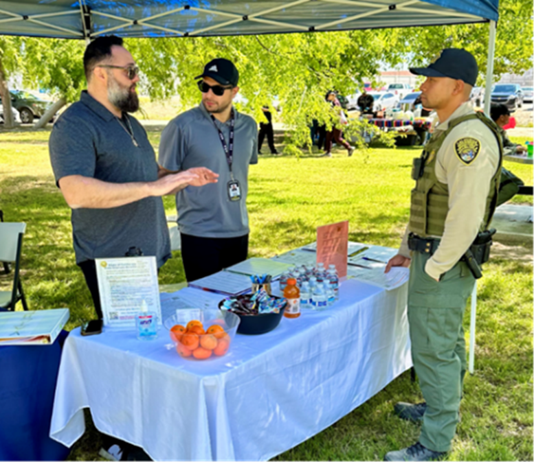 staff speaking at COR wellness fair