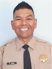 Gaylord Ben Gemo wearing his correctional officer's uniform.