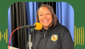 CDCR restitution manager Chemere Lee with a microphone.