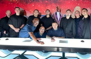 Reentry program participants and staff pose for a photo at the live taping of a TV show.