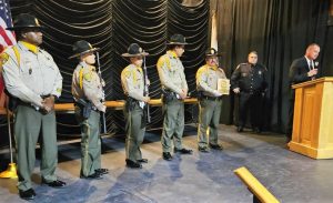 Pelican Bay Honor Guard stands on a stage as they are honored in Del Norte awards ceremony.