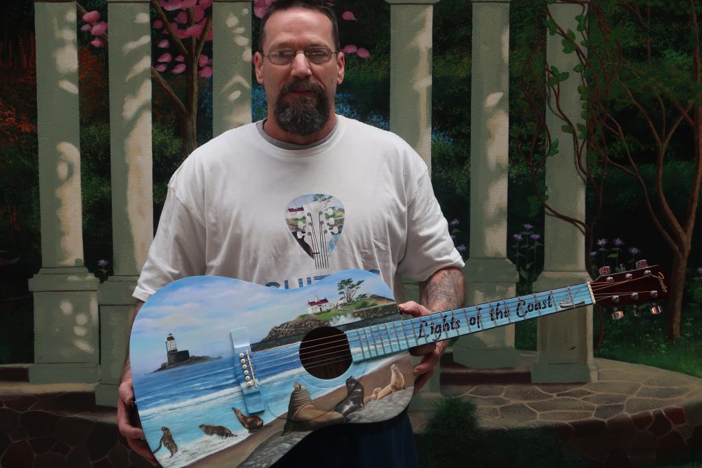 PBSP incarcerated holding guitars