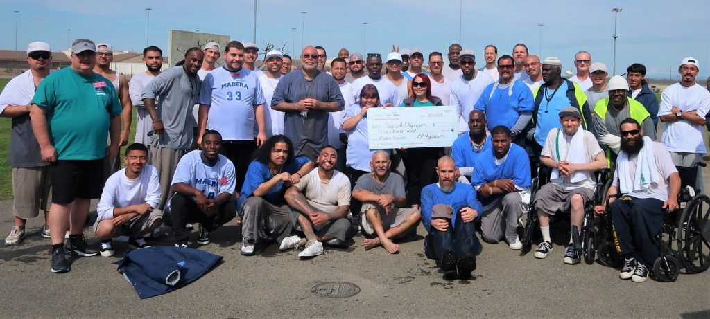 Group photo with over-sized check for Special Olympics Polar Plunge at VSP.