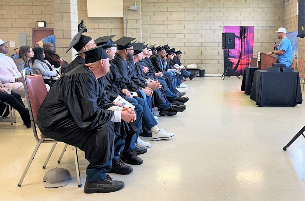 Youth peer mentor graduates sitting during a ceremony at VSP.