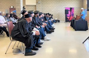 Youth peer mentor graduates sitting during a ceremony at VSP.