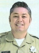 Reymundo Caldera wearing his correctional officer uniform.