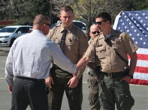 Warden Stephen Smith shakes hands with a new sergeant at Pelican Bay.