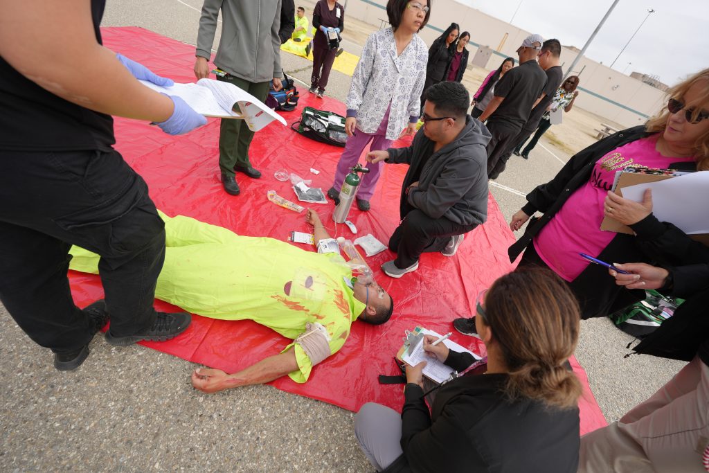 individual acting hurt laying on the ground
