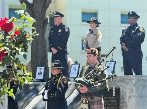Law enforcement officers watch over the peace officers memorial wall in Solano County.
