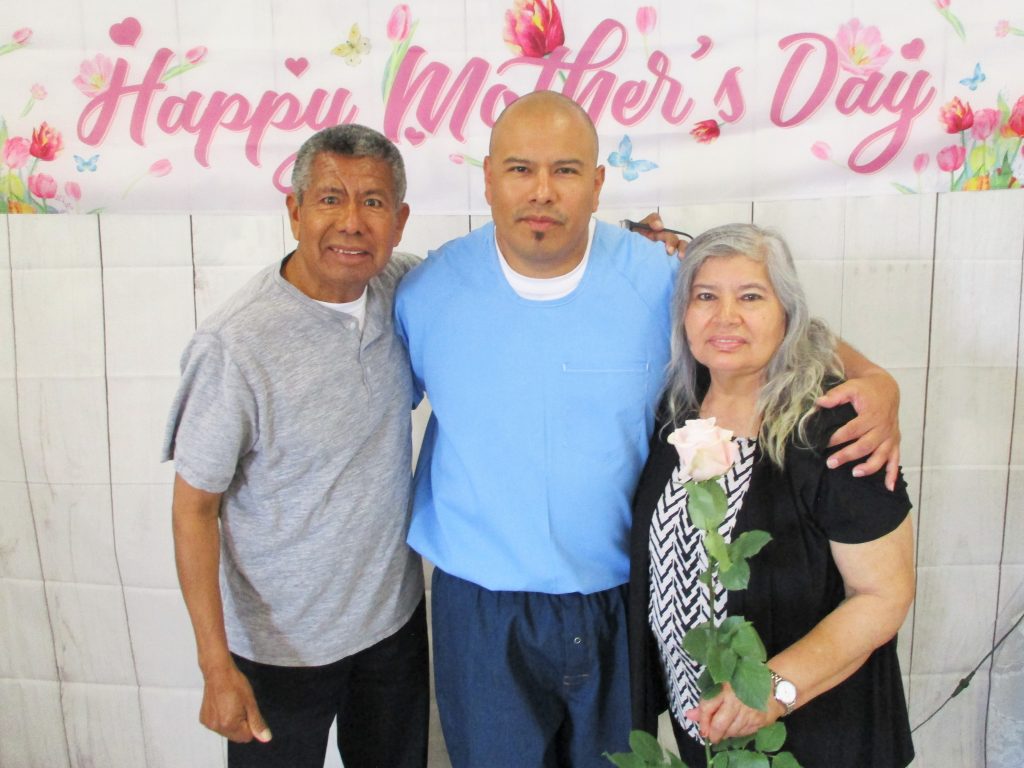 An older couple visit their incarcerated son in Norco.