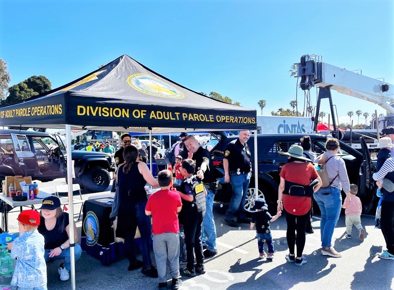 The public interacts with parole staff at a Long Beach community event.