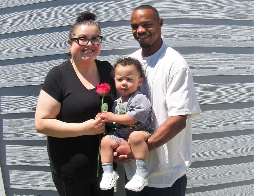 A mother and child visiting their incarcerated loved one for Mother's Day at a CDCR prison in Ione, California.
