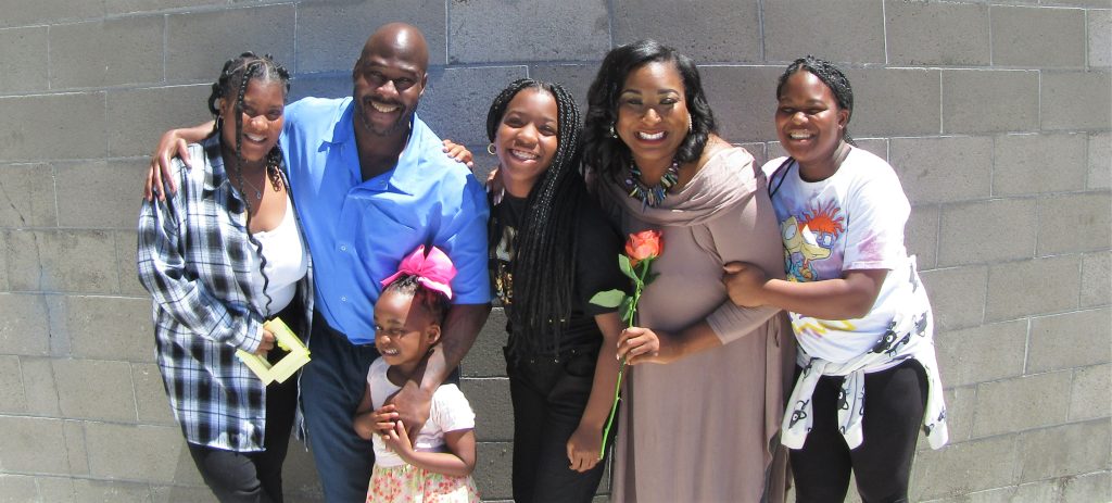 A family visits their incarcerated loved one. 
