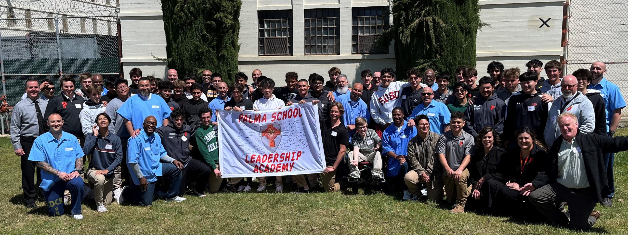 Palma Leadership Academy students take group photo with incarcerated at CTF.