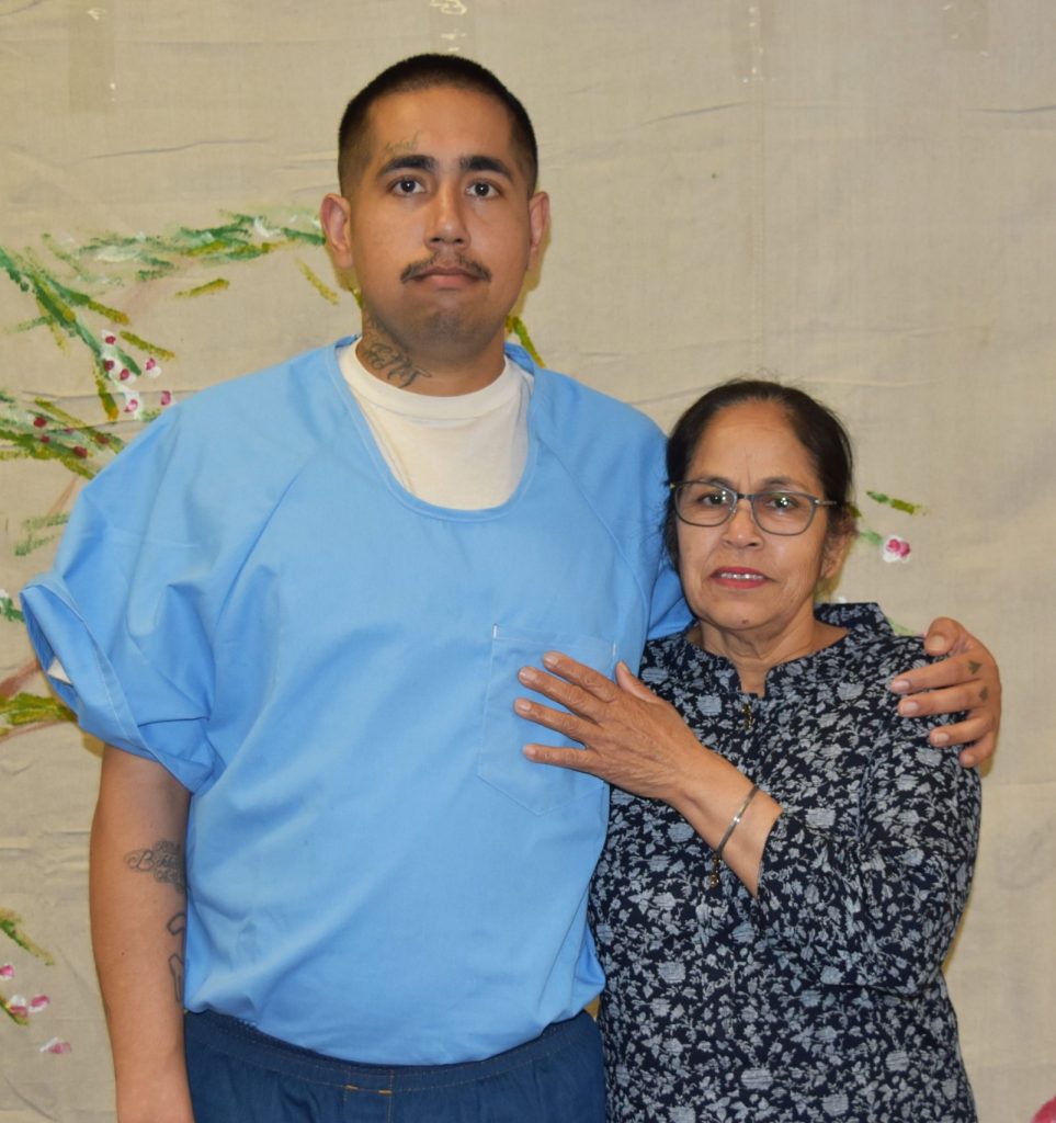 An incarcerated young man and his mother.