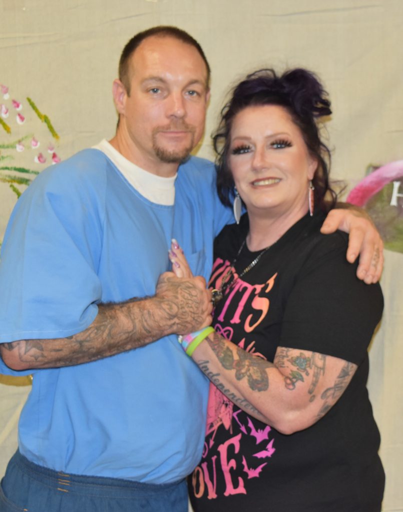 Mother's Day visiting with woman and incarcerated person hugging.