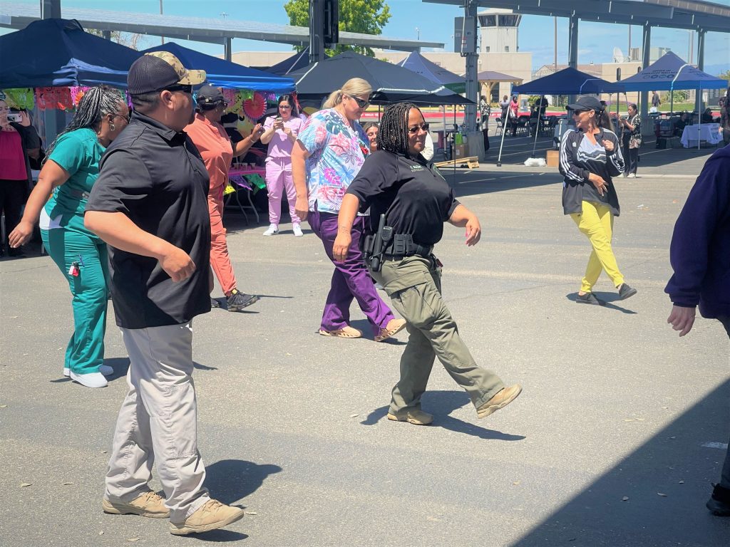 Staff members dancing during an event at Valley State Prison.