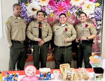 Wasco State Prison visiting department staff with Mother's Day decorations.