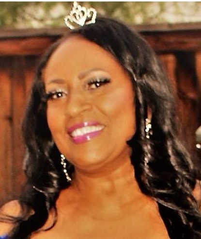 Ann Lee Wesson-Williams smiling and wearing a tiara.