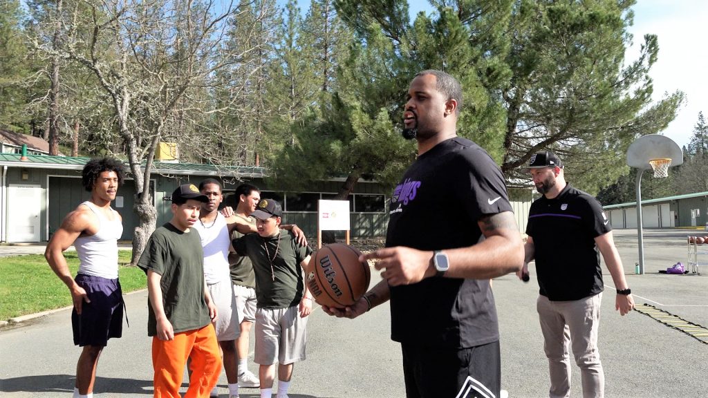 A Kings youth coach talks with Pine Grove incarcerated firefighters. 