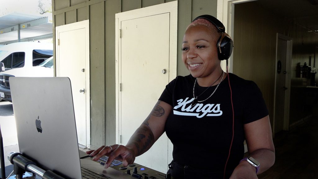 Female DJ plays music at Pine Grove.