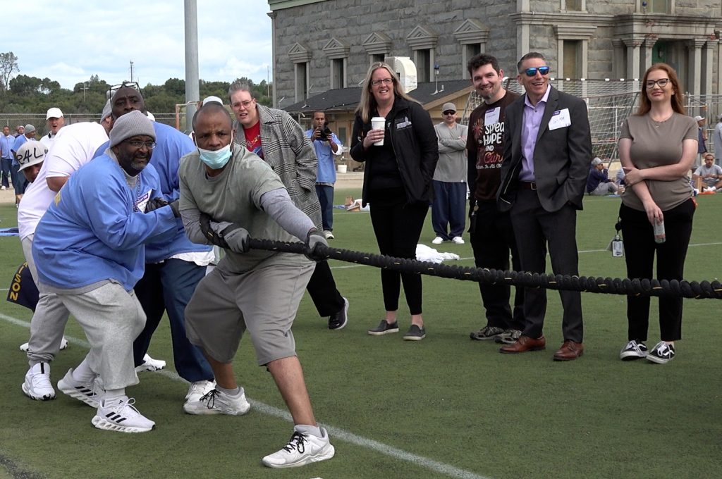 Tug-of-war rope full with incarcerated people at Folsom State Prison.