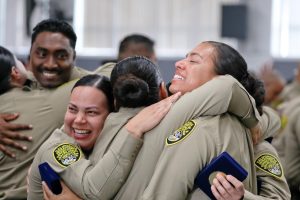 200 new CDCR correctional officers celebrate their academy graduation with hugs and tears.