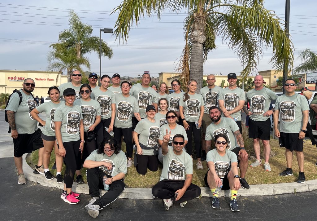 California Rehabilitation Center staff wearing torch run t-shirts posing for a group photo.