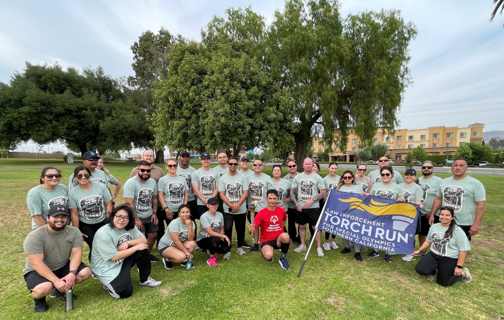 Law Enforcement Torch Run with California Rehabilitation Center staff posing for a group photo.