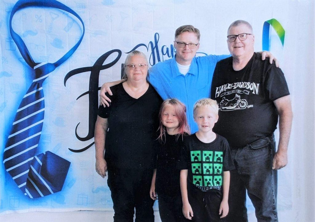 High Desert State Prison visiting with two kids, a man and woman, visiting an incarcerated man. 