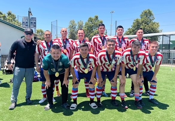 Wearing gold medals is the Ironwood State Prison Football Club.