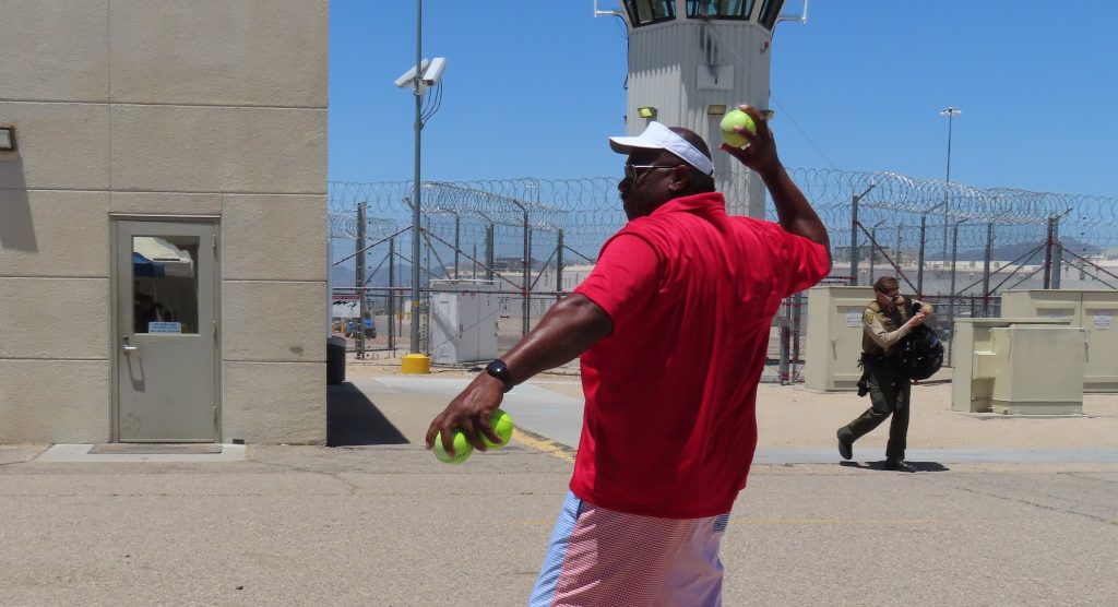 A chief deputy warden throws a ball at Ironwood State Prison.