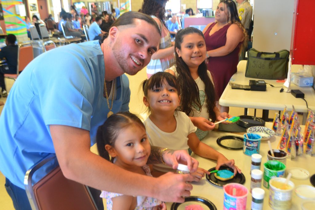 Decorating cookies for Father's Day at Valley State Prison. 