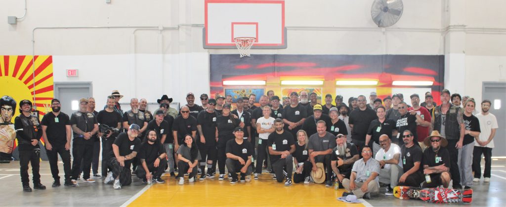 Volunteers and prison staff group photo at X-Fest.