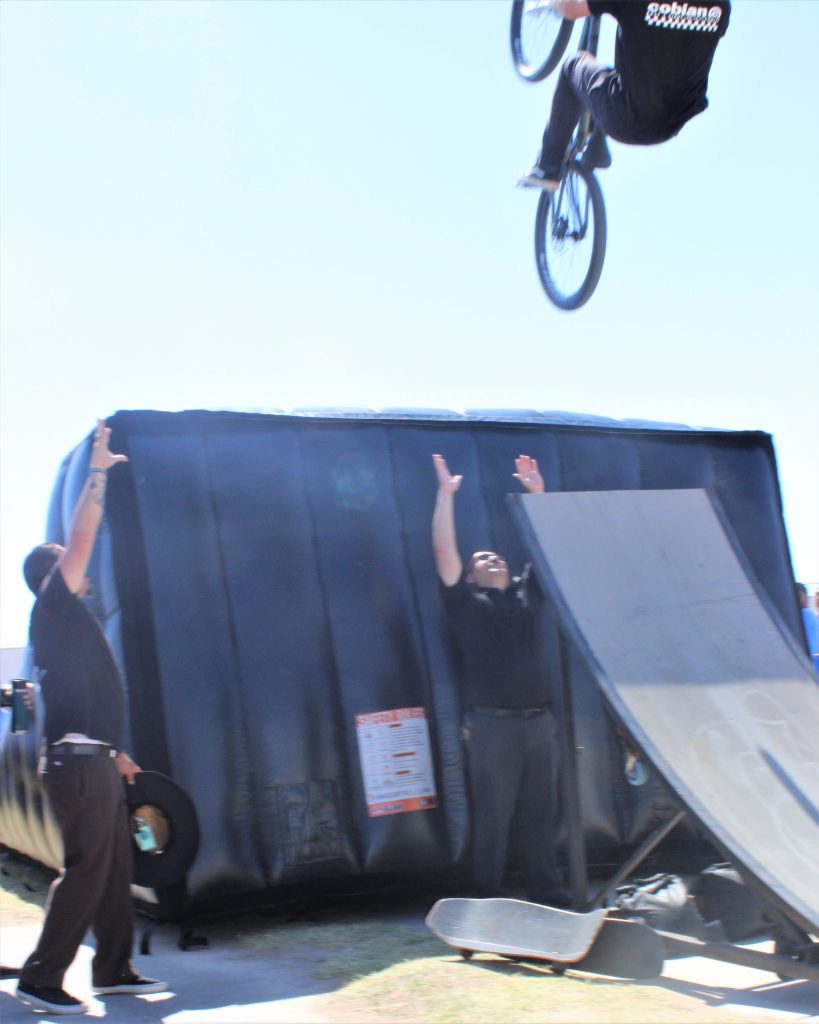 X-Fest event with warden standing underneath a bicycle ramp.