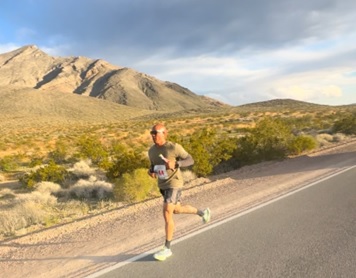 Man running in desert.