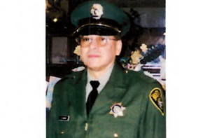 George Chacon wearing a correctional officer uniform.