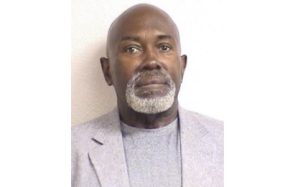 Wayne Jackson smiling and looking at camera.