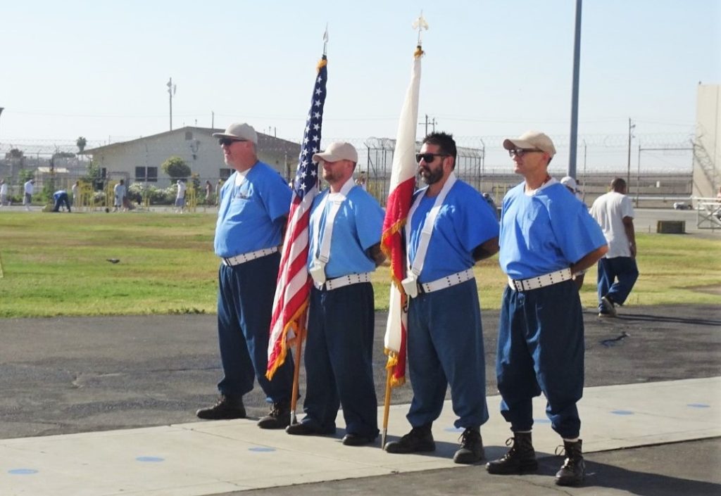 Fourth of July event with four incarcerated people acting as the honor guard at Avenal State Prison.