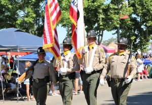 CDCR Color Guard walks in a parade on the Fourth of July in Galt.