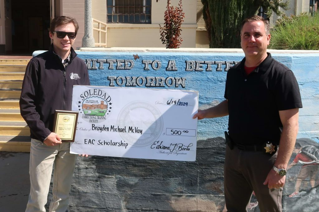 CTF Warden presents student with one of the EAC scholarships