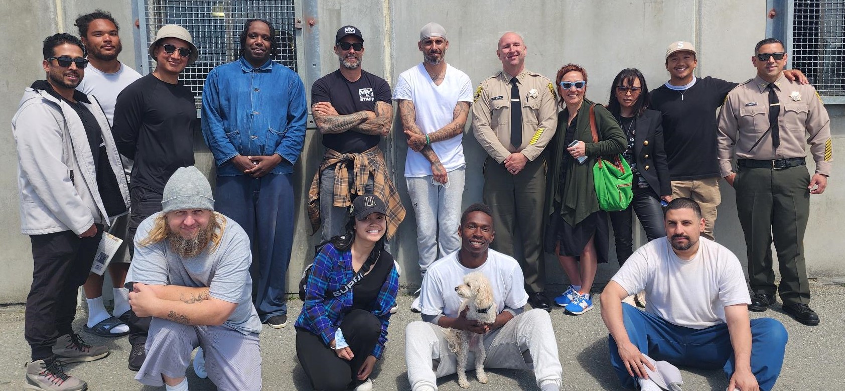 Zack Skow takes group photo with San Quentin staff and residents