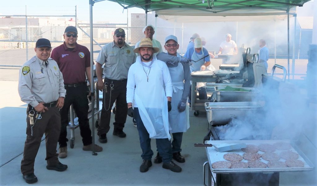 Valley State Prison staff and incarcerated people with barbecue grills.