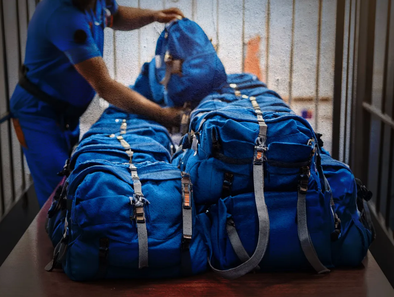 SQ passing out backpacks