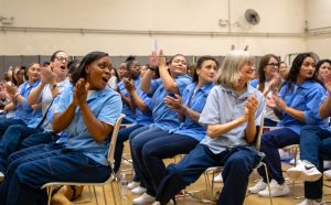 Other graduates at CIW cheer on those earning CALPIA job certifications and apprenticeships.