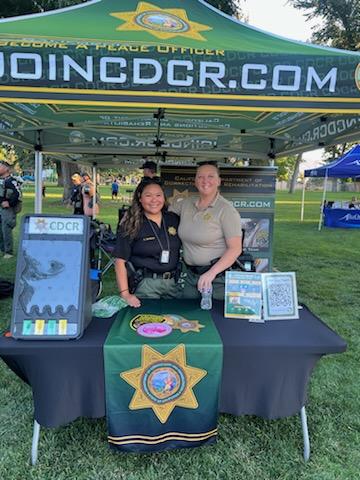 CDCR booth with two people.