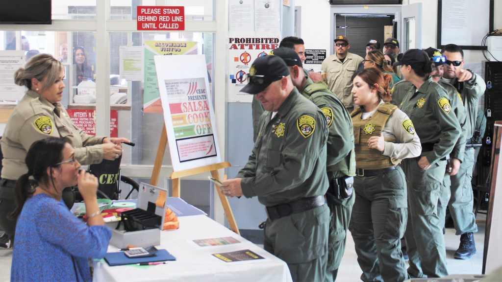 Salsa contest with staff waiting in line to enter.