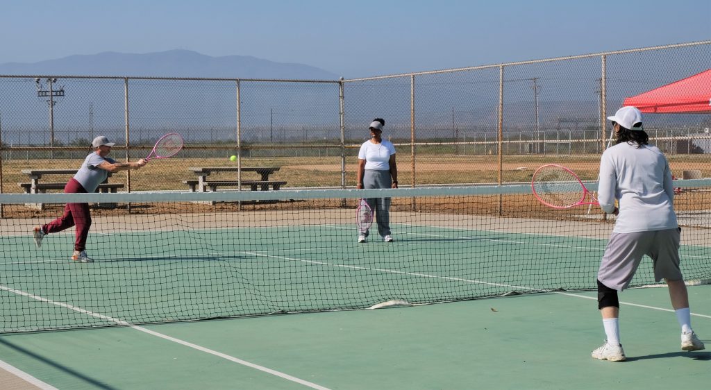 Playing tennis at California Institution for Women.