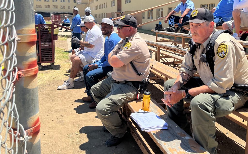 Incarcerated people and CMC staff watch the derby.