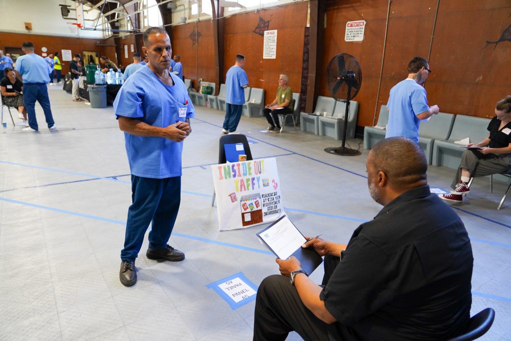 An incarcerated person pitches a business plan at CRC Defy Ventures.
